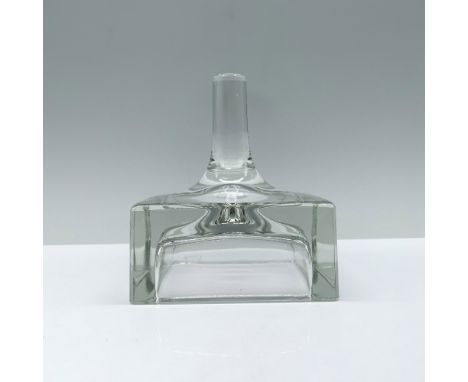 A sleek clear ring holder featuring a stump design atop a flat, hollow square base. Dimensions: 3.5"L x 3.5"W x 4"HManufactur