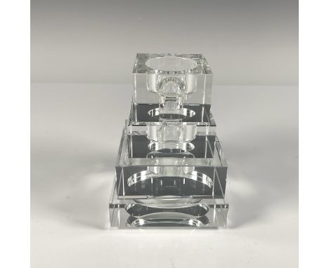 Elegant thick clear crystal that result in a unique square candle holder when combined. Designed by Karim Rashid. Each with t