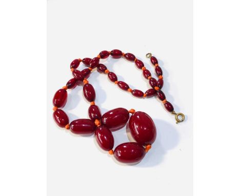 Vintage cherry amber bakelite necklace  has internal swirls measures approx 48.cm long weight 25g 