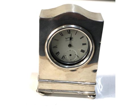 Vintage silver pocket watch stand clock design hallmarks worn age related wear marks and dents measures approx 10cm by 6.5cm 