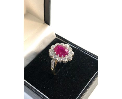 Fine 18ct gold diamond and ruby ring central ruby is 2.78ct  with approx 1ct diamonds around . 