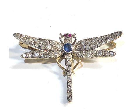 Fine diamond and jewel set dragonfly brooch wings and body set with rose diamonds with central sapphire and ruby eyes set in 