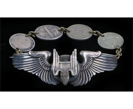 An interesting bracelet made from a set of World War Two U.S. Army Air Force Aerial Gunners silver wings marked Sterling to t