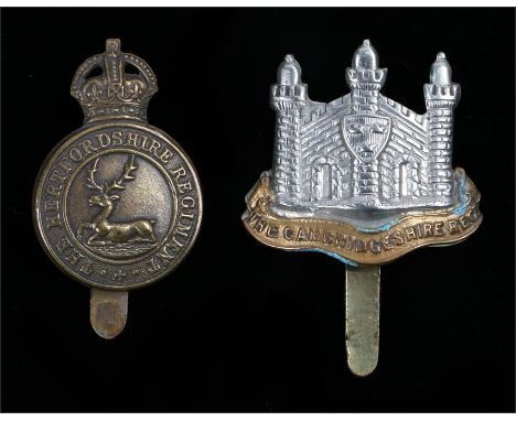 Cap badge to the Cambridgeshire Regiment, slider to the reverse, K&K 1817, together with a Hertfordshire Regiment cap badge, 