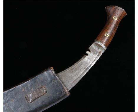 World War Two Kukri in leather scabbard, blade is 33 cm in length with no distinct markings, the scabbard is stamped GWL Co 1