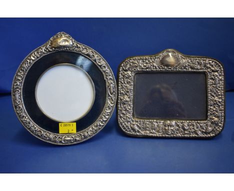 A Victorian silver circular easel back photograph frame, by James Deakin &amp; Sons, Chester 1900; together with another simi