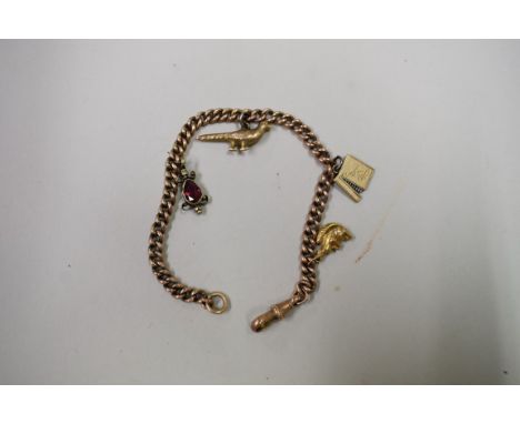 A rose gold chain, having two 9ct gold charms and two unmarked charms attached, 