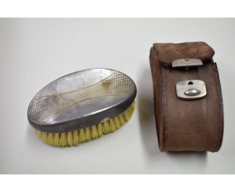 A cased silver christening egg cup and spoon, by Bishton's Ltd, Birmingham 1960; an engine turned napkin ring; and a silver b