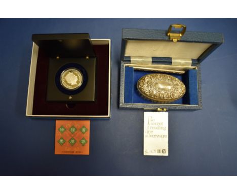 A cased silver backed brush and comb set, by&nbsp;Broadway &amp; Co, Birmingham 1988;together with a cased silver 2004 Elizab