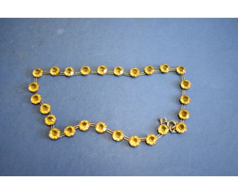 An amethyst and seed pearl necklace,&nbsp;having 9ct gold clasp; together with a topaz set necklace; and an amethyst set brac