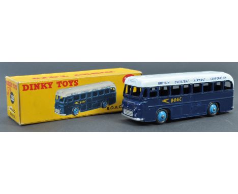 An original vintage Dinky Toys made diecast model No. 283 BOAC Coach. Two-tone body in blue, with white roof and light blue h