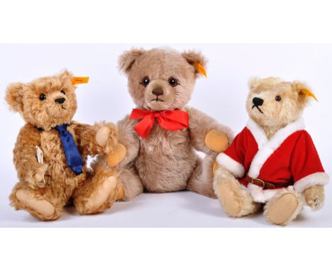A collection of x3 original German Steiff made soft toy teddy bears with yellow tag and gold button to the left ears. The col