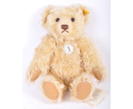 A German Steiff made teddy bear animal from the Classic Series No. 004353 in blonde mohair with jointed limbs, growler to bel