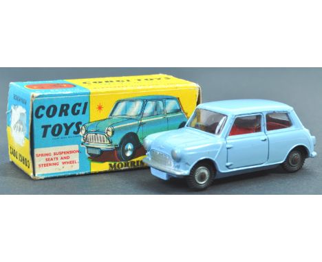 An original vintage Corgi Toys made diecast model No. 226 ' Morris Mini Minor '. Blue, with red interior and steering wheel. 