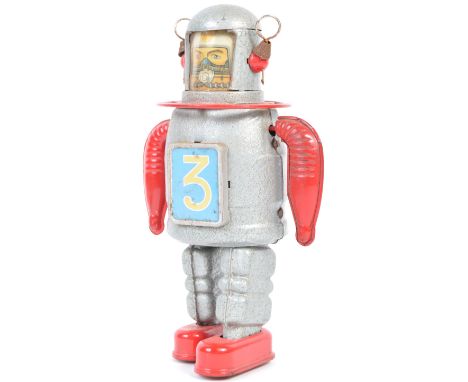 A 20th Century retro vintage Japanese tinplate wind up clockwork space man astronaut figurine having red pressed tin arms and