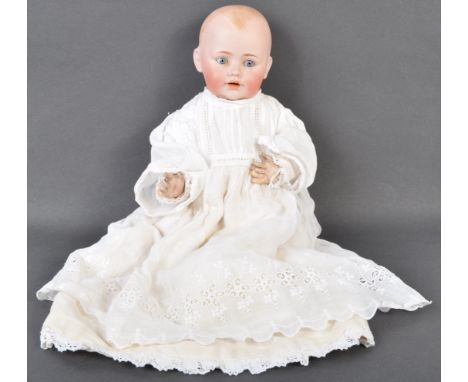 An early 20th century antique J.D.K Johann Daniel Kessler German made bisque headed doll. The doll having fixed blue glass ey