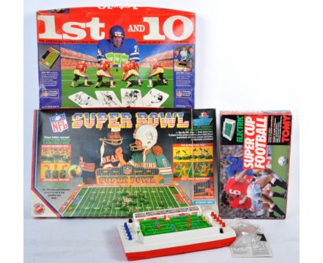 A collection of three vintage retro 1980's electronic board games comprising a boxed Tomy Super Football Cup in working condi