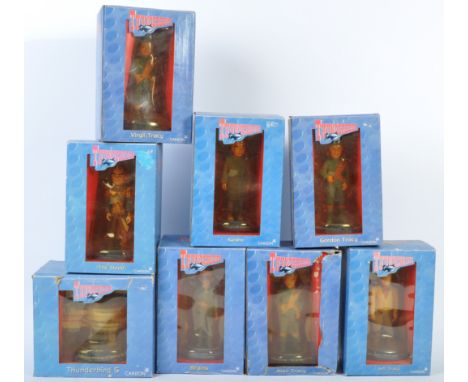 A collection of x8 Carlton made Thunderbirds ceramic action figures - each statue appearing mint, within the original boxes. 