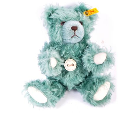An original German Steiff made soft toy teddy bear 005305 with growler. The classic edition bear having the gold button tag t