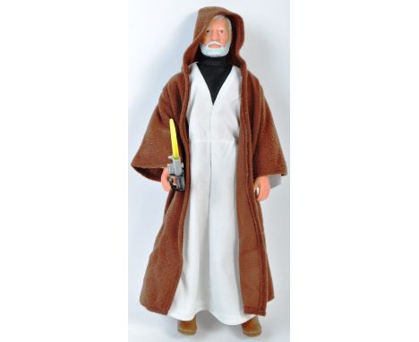 An original vintage Kenner / General Mills made Star Wars 12" action figure ' Obi Wan Kenobi '. The figure complete with cloa