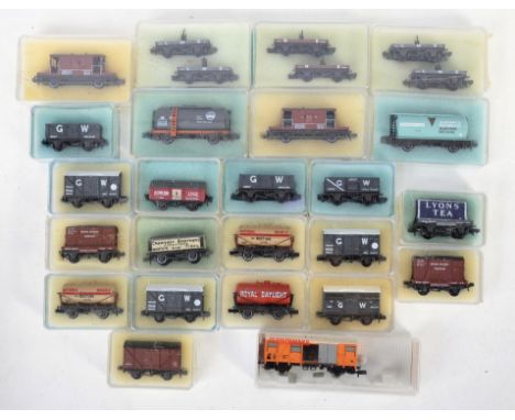 A collection of 25+ assorted original vintage Peco made N gauge model railway train set locomotive rolling stock to include d