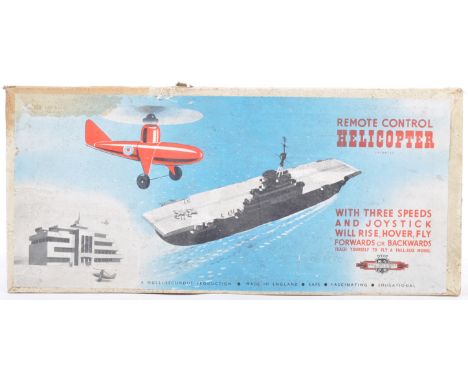 An original vintage British made Nelli Secundus tinplate battery operated remote control model helicopter. The toy featuring 