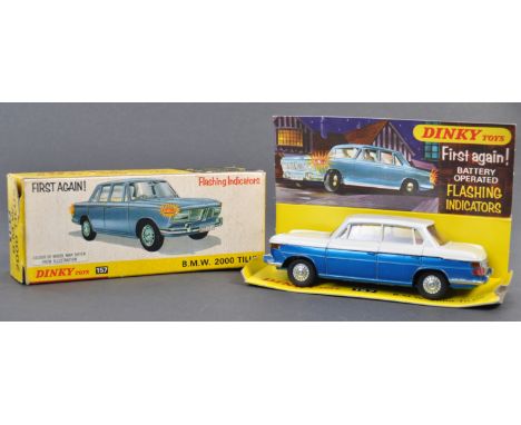 An original vintage Dinky Toys made diecast model No. 157 BMW 2000 Tilux. Blue and white two-tone body, with ' Flashing Indic