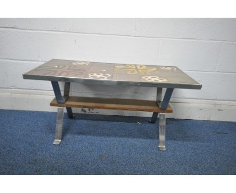 A MID CENTURY TILE TOP COFFEE TABLE, in the manner of Juliette Belarti, the top decorated with floral patterns, on shaped chr