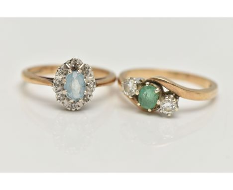 TWO 9CT GOLD GEM SET RINGS, the first an oval cluster, set with an oval cut aquamarine, eight claw set to a surround of illus