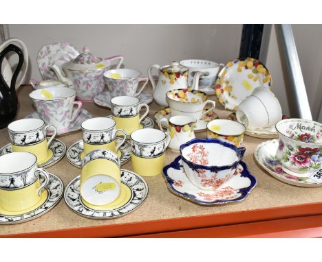 A GROUP OF TEA AND COFFEE WARE, comprising six Foley China E. Brain &amp; Co. coffee cans and five saucers with a yellow band