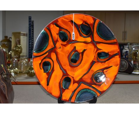 A LARGE POOLE POTTERY 'PEACOCK' DESIGN CHARGER, designed by Anita Harris, diameter 42cm, with original Poole sticker and shop