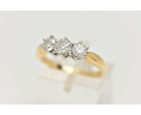 AN 18CT GOLD DIAMOND THREE STONE RING, three round brilliant cut diamonds, each claw set in a white metal mount, stamped diam