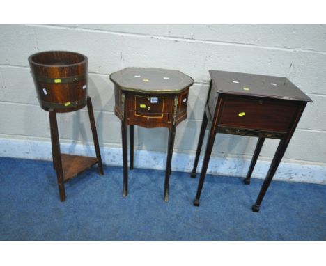 A FRENCH MAHOGANY AND INLAID LAMP STAND, with wavy edge, glass insert and brass border, three drawers on shaped legs, width 4