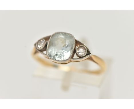 AN AQUAMARINE AND DIAMOND RING, set with a central cushion cut aquamarine, in a milgrain setting, flanked with two single cut