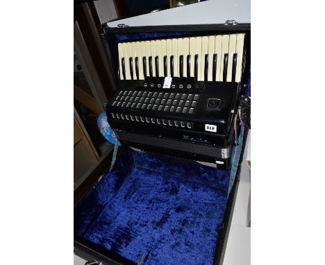 A CASED BAILE ACCORDION, in gloss black, with eighty buttons, thirty seven keys and seven tone switches, in a hard case, with