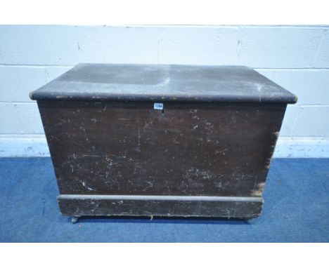 A VINTAGE PINE TOOL CHEST, with twin metal handles, on castors, width 94cm x depth 55cm x height 67cm, containing various met