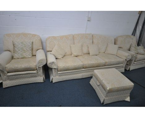 A GOLD AND FLORAL UPHOLSTERED FOUR PIECE LOUNGE SUITE, comprising a three seater sofa, length 229cm x depth 90cm x height 81c