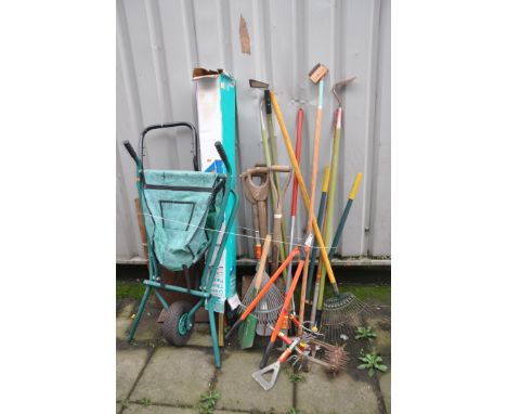 A COLLECTION OF GARDEN TOOLS including a sack truck (distressed), a parasol (unchecked), forks, spades, rakes, etc