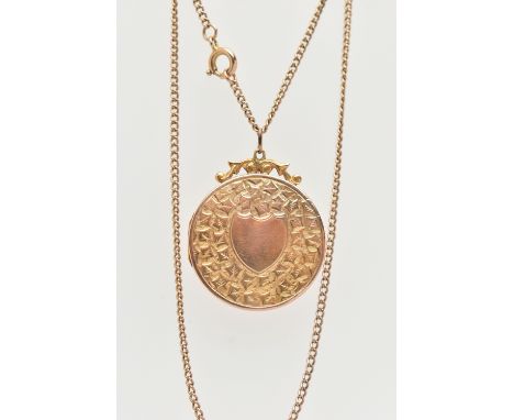 AN EARLY 20TH CENTURY LOCKET AND CHAIN, 9ct gold front and back circular locket, ivy leaf detail with a vacant shield cartouc