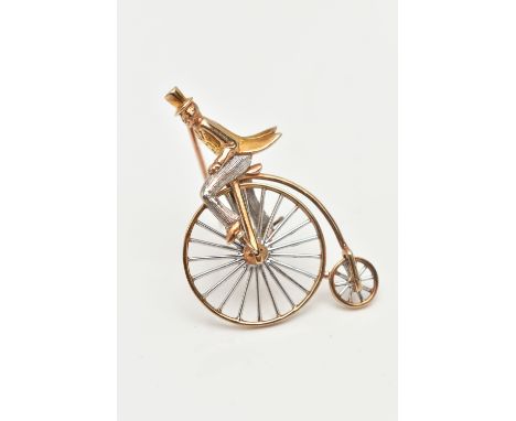 A 9CT GOLD PENNY FARTHING BROOCH, a white and yellow gold gentleman riding a penny farthing bicycle, approximate length 41.5m
