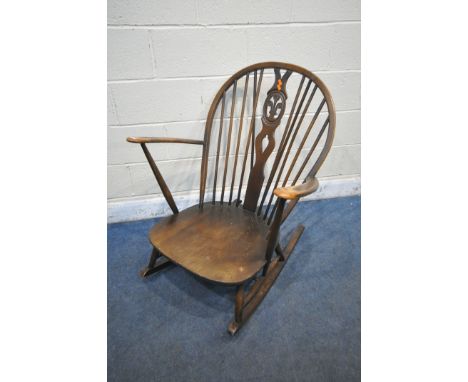 AN ERCOL PRINCE OF WALES BACK ROCKING CHAIR with open armrests, width 73cm x depth 83cm x height 93cm (condition:-missing ori