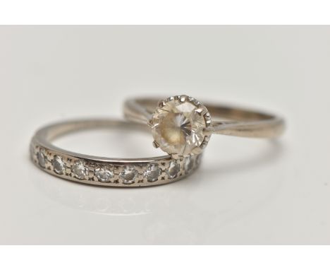 A DIAMOND HALF ETERNITY RING AND AN 18CT GOLD PASTE RING, the first designed as a line of eleven brilliant cut diamonds, esti