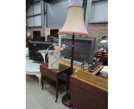 A traditional mahogany standard lamp