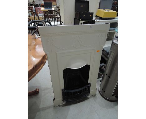 A period cast fireplace with integral grate