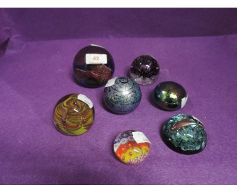 A selection of glass paper weights including Caithness Pilgramage