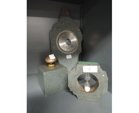 A selection of slate items including egg timer, barometer, and paperweigh