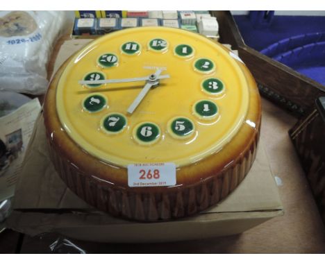 A ceramic Kenzie Boutique clock