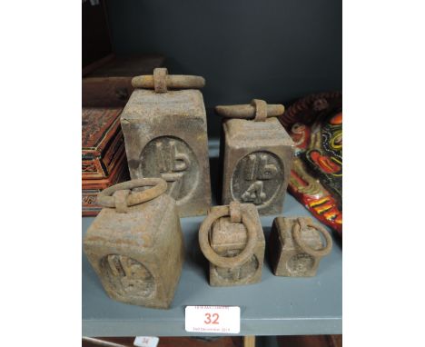 A set of cast pound kitchen scale weights 