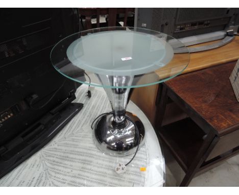 A modern futuristic chrome lamp tableGood condition, no scratches or chips to glass, no scratces or dents to chrome. Slight r