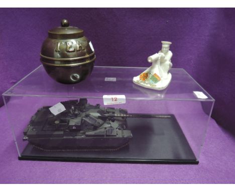 A replica scale model military tank in case and similar